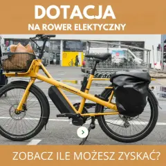 Żółty rower elektryczny z koszykiem i sakwą. Dowiedz się, dla kogo jest dofinansowanie do roweru elektrycznego i ile możesz zyskać.