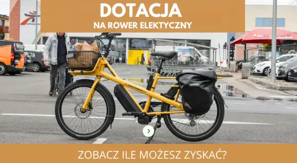 Żółty rower elektryczny z koszykiem i sakwą. Dowiedz się, dla kogo jest dofinansowanie do roweru elektrycznego i ile możesz zyskać.